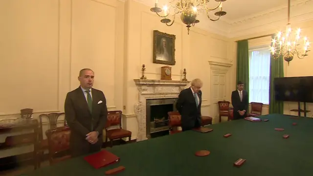 Boris Johnson observes minute's silence