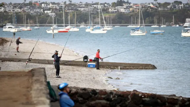 People fishing at the beach