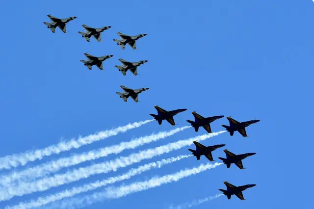 The US Navy's Blue Angels and US Air Force's Thunderbirds perform a flyover tribute to honor NYC COVID-19 frontline workers on 28 April, 2020 as seen from Weehawken, New Jersey