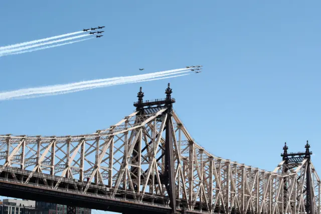 The Navy's Blue Angels and the Air Force Thunderbirds fly over Ed Koch Queensboro Bridge on 28 April, 2020 in New York City