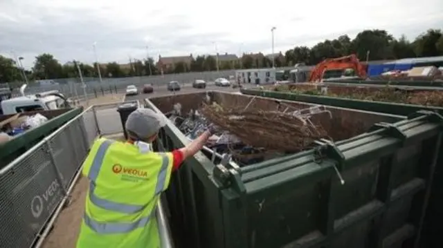 Council worker at tip