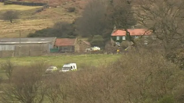 Police vehicles at scene