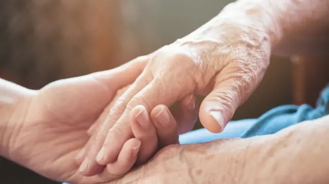 Hands being held close up