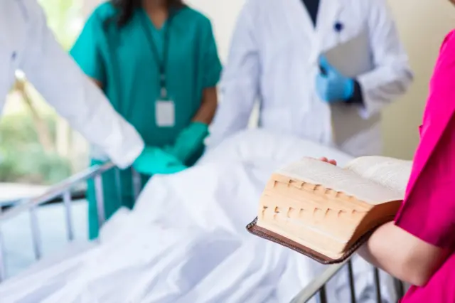 Bible being read patient's beside