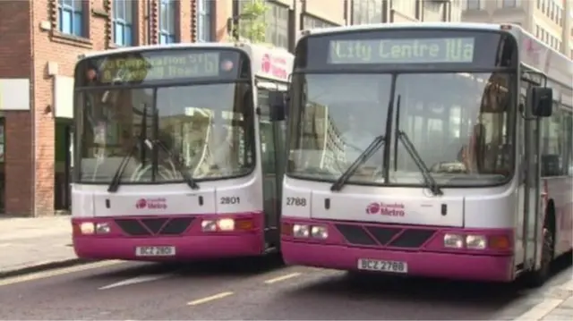 Two single-decker Translink buses