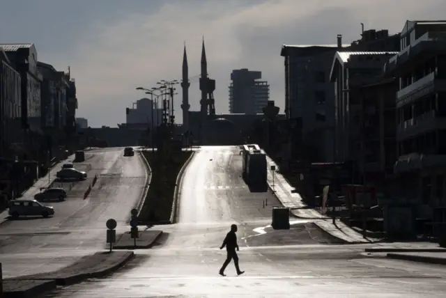 A silhouette of a man crossing an empty street, Ankara, Turkey