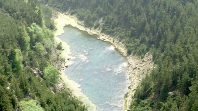 aerial photo of beauty spot. A lake has formed at the 'Canyons' after opencast mining stopped on the site