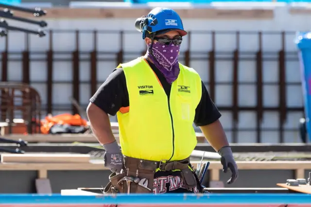 A building worker wearing a covering