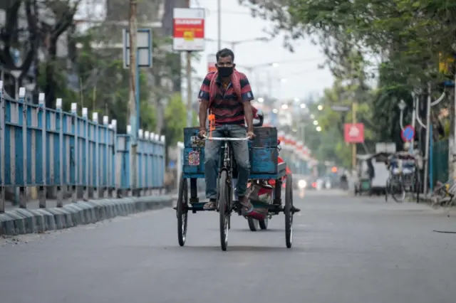 A man rides a tricycle in India