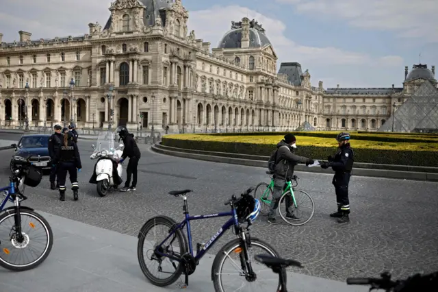 Police checks in front of the Louvre Museum in Paris on 2 April 2020