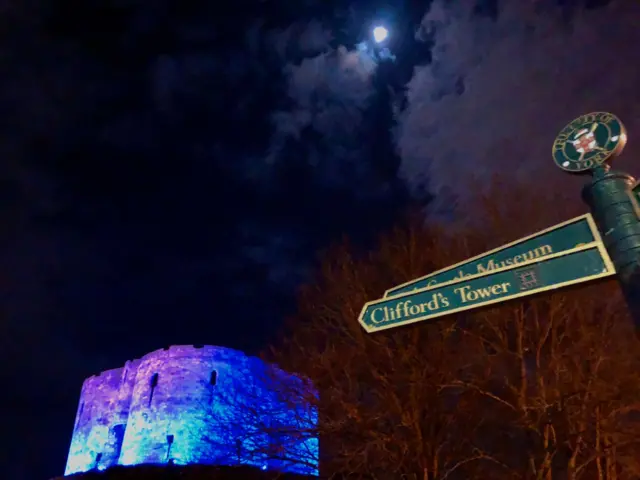 Clifford's Tower lit blue