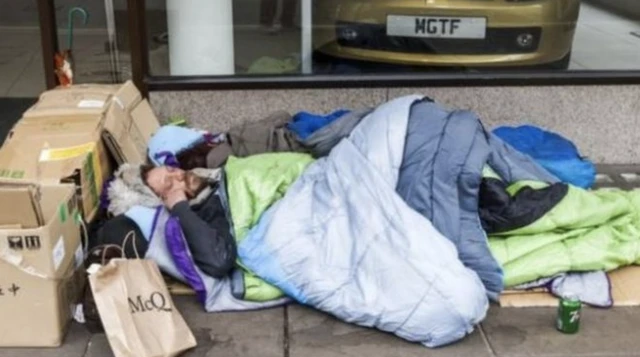 Homeless person sleeps on the street