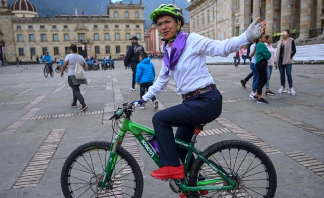 The mayor of Bogotá, Claudia López, posing on a bicycle