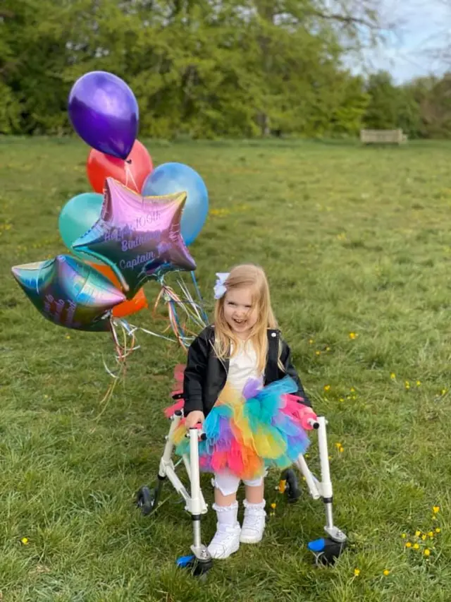 Daisy wearing rainbow colours for her sponsored walk for the NHS