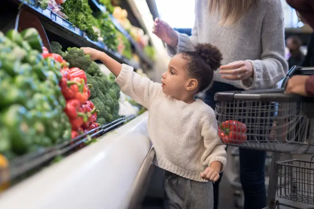 child in a supermarket