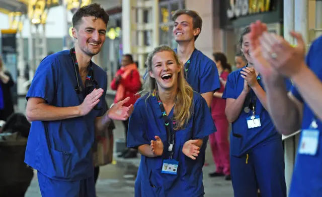 Medics outside the Chelsea and Westminster Hospital in London join in the applause to salute local heroes during Thursday"s nationwide Clap for Carers to recognise and support NHS workers and carers fighting the coronavirus pandemic.