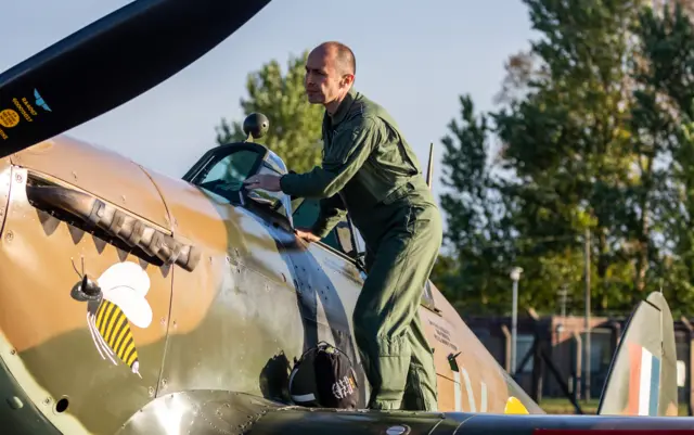 Pilot getting into RAF plane