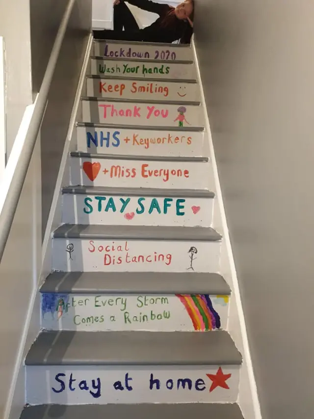 Maisie at the top of the stairs