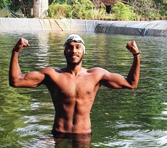 India"s swimmer SP Likith poses in a makeshift pool