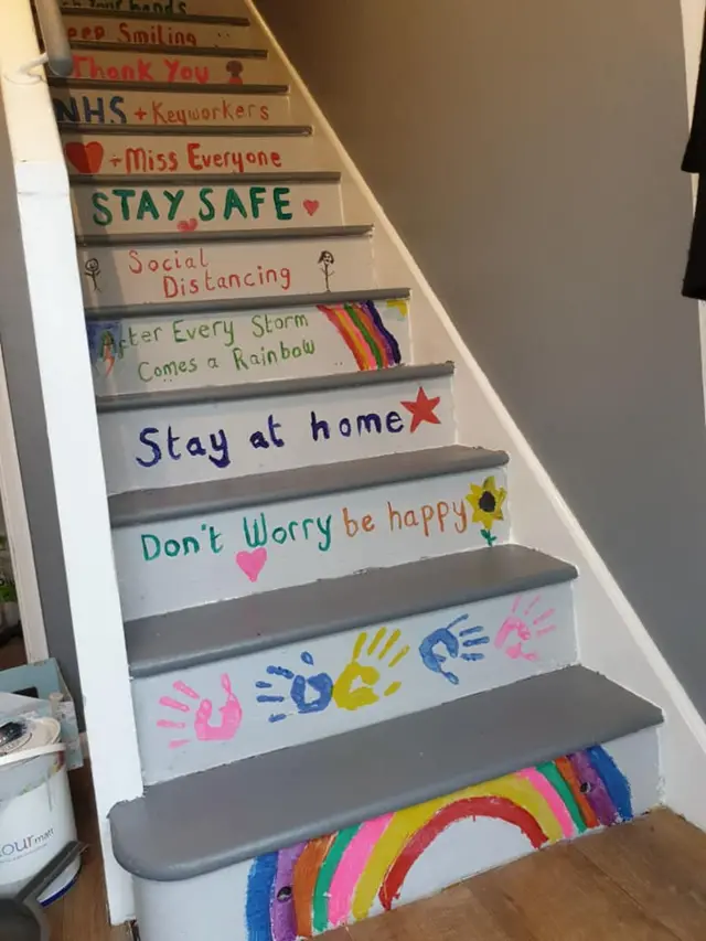 Stairs with colourful pictures and messages