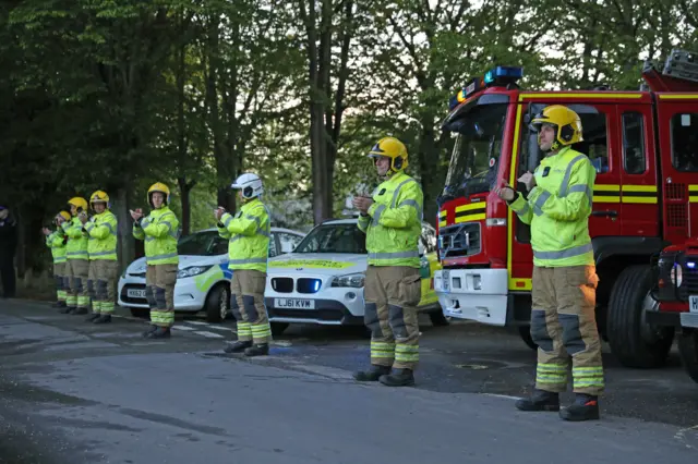 Members of the Hampshire Fire and Rescue Service in Hartley Wintney, near Basingstoke, join in the applause to salute local heroes during Thursday"s nationwide Clap for Carers to recognise and support NHS workers and carers fighting the coronavirus pandemic