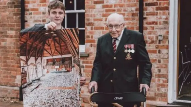 Benjie Ingram-Moore and his grandfather show the thousands of birthday cards received