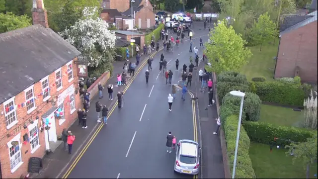 A street doing clap for carers