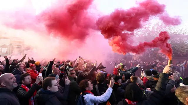 Liverpool fans crowd outside Anfield