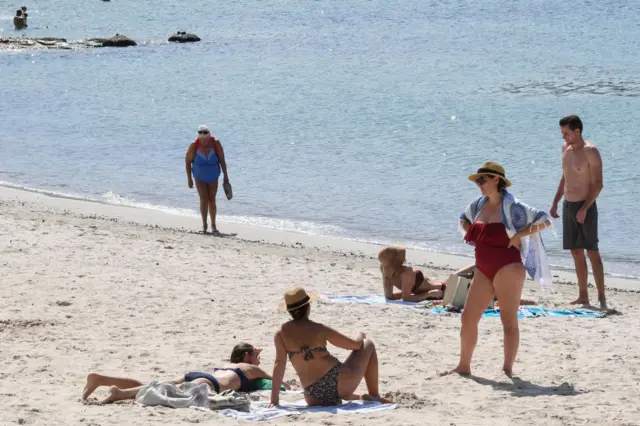 Sunbathers on Balmoral Beach, Sydney earlier this week