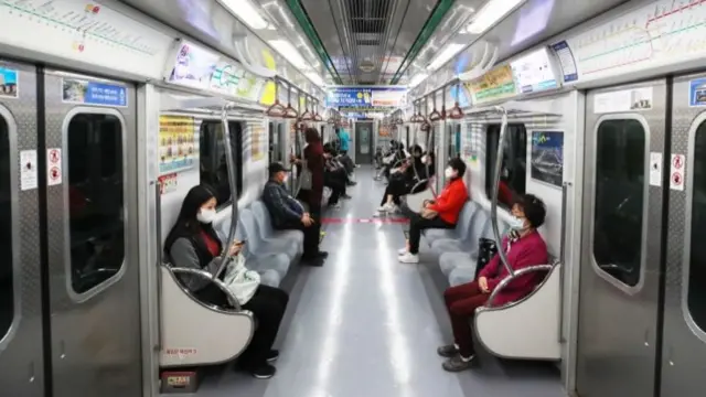 Social distancing on a metro train in Seoul, South Korea, 23 March 2020