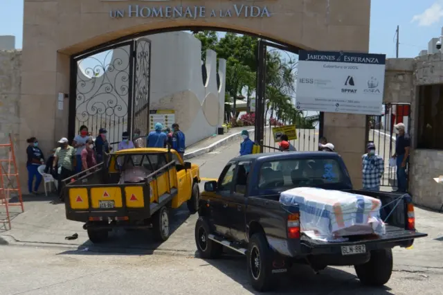 Cars carrying coffins with the deceased arrive at the Jardines de Esparanza cemetery in Guayaquil, Ecuador, 3 April 2020