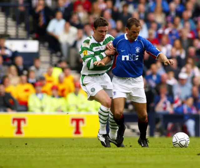 Alan Thompson tackles Rangers' Ronald de Boer