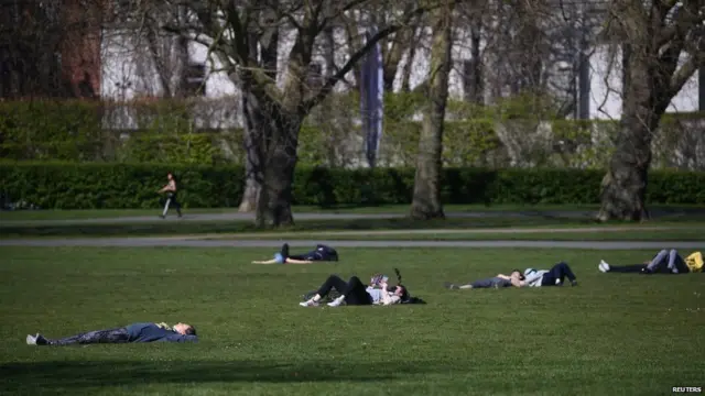 Sunbathers in Greenwich Park, south London on Saturday