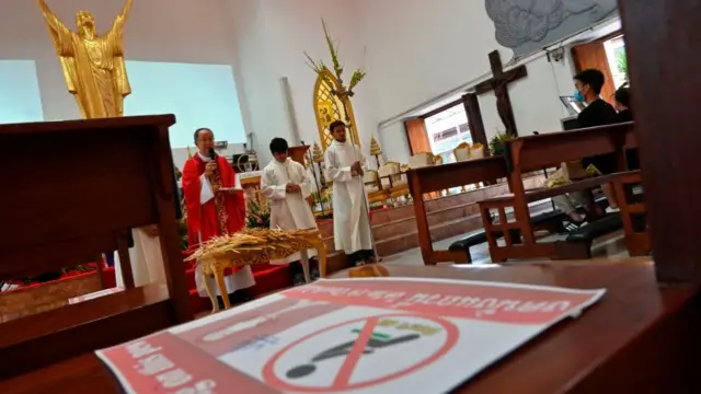 Sign on pew in Bangkok church