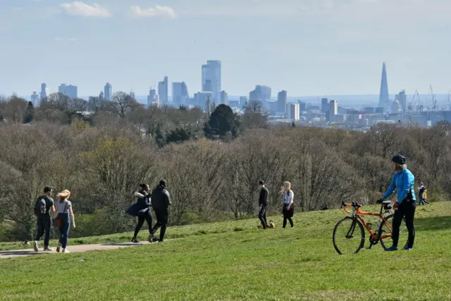 Visitors in Hampstead Heath, London on Saturday