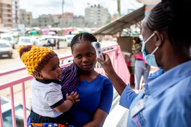 Temperature checks are taking place in parts of Nairobi, Kenya, as the government bans travel in and out of the city