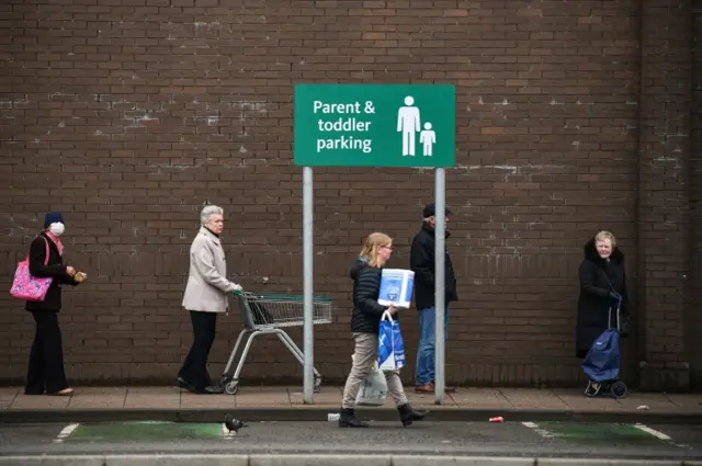 Shoppers queue in Glasgow