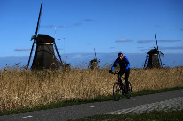 Cyclist on Kinderdiijk, which is closed because of Dutch lockdown measures (file photo)