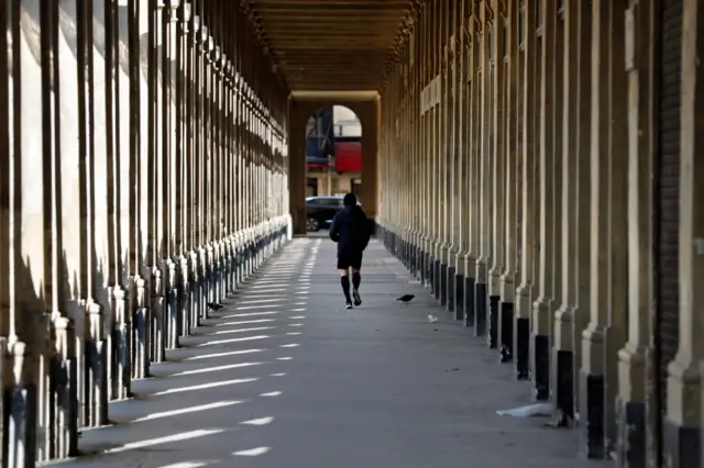 A jogger at the Palais Royal, Paris