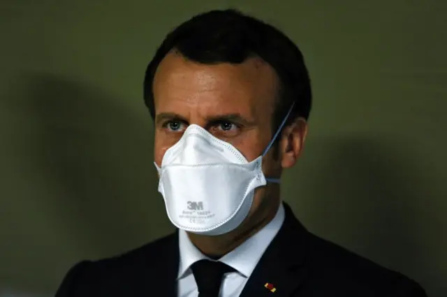 Emmanuel Macron in a face mask