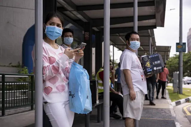 Singaporeans at a bus stop on 6 April 2020