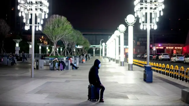 A man sitting alone at the station