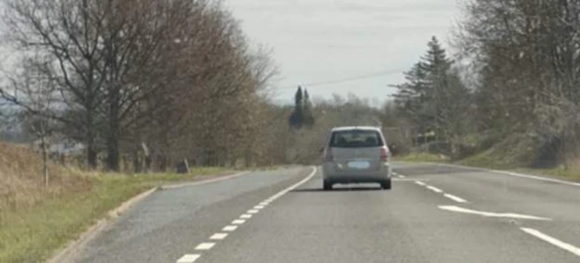 Car travelling along road