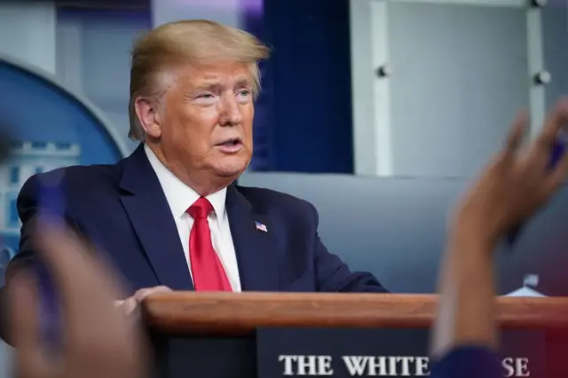 Donald Trump answers questions from reporters during the daily briefing on the novel coronavirus