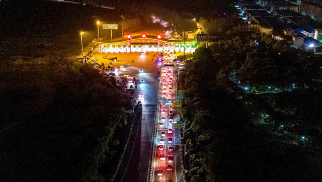 An aerial photo shows cars queuing at a toll road