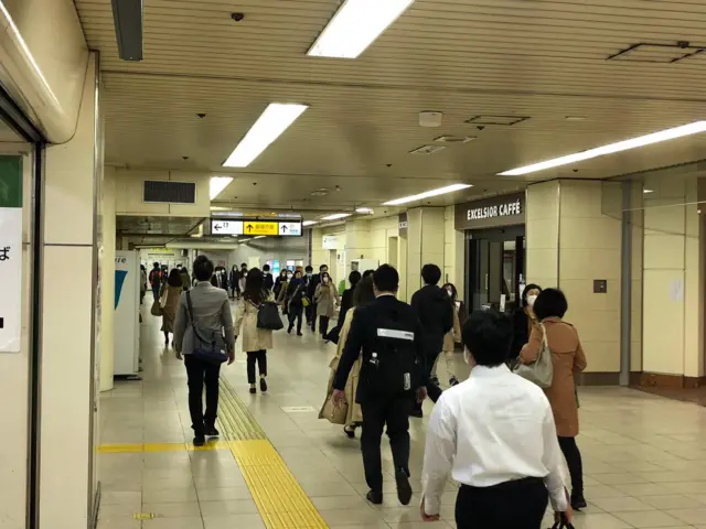 Commuters in an underground walkway in Tokyo