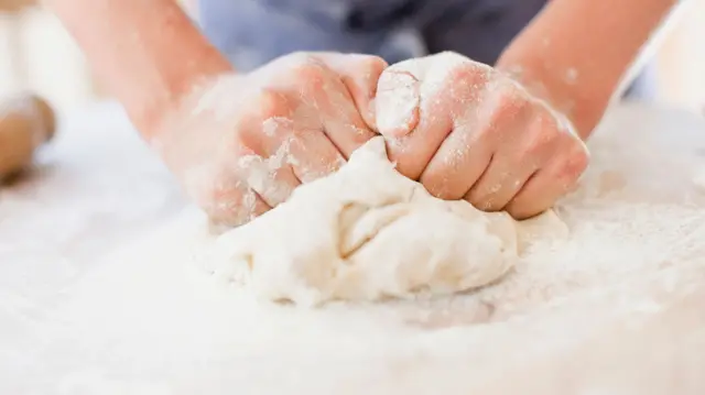 Person kneading dough