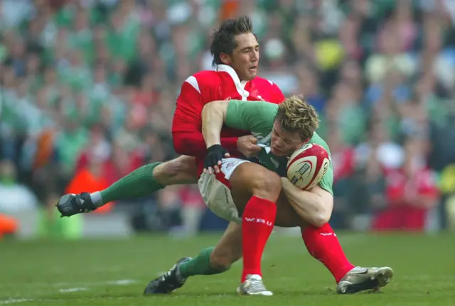 Wales centre Gavin Henson tackles Ireland captain Brian O'Driscoll