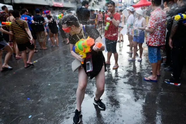 People play with water pistols during Songkran Water Festival to celebrate Thai New Year, in Bangkok, Thailand 14 April, 2019