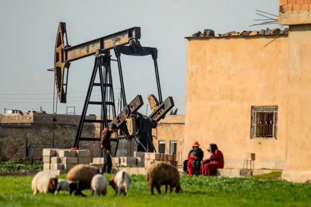 A crude oil pump jack in operation.